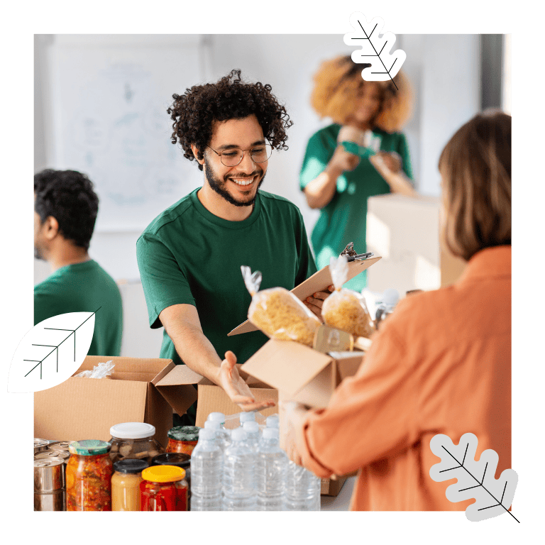 Photo of individuals preparing meal packages.