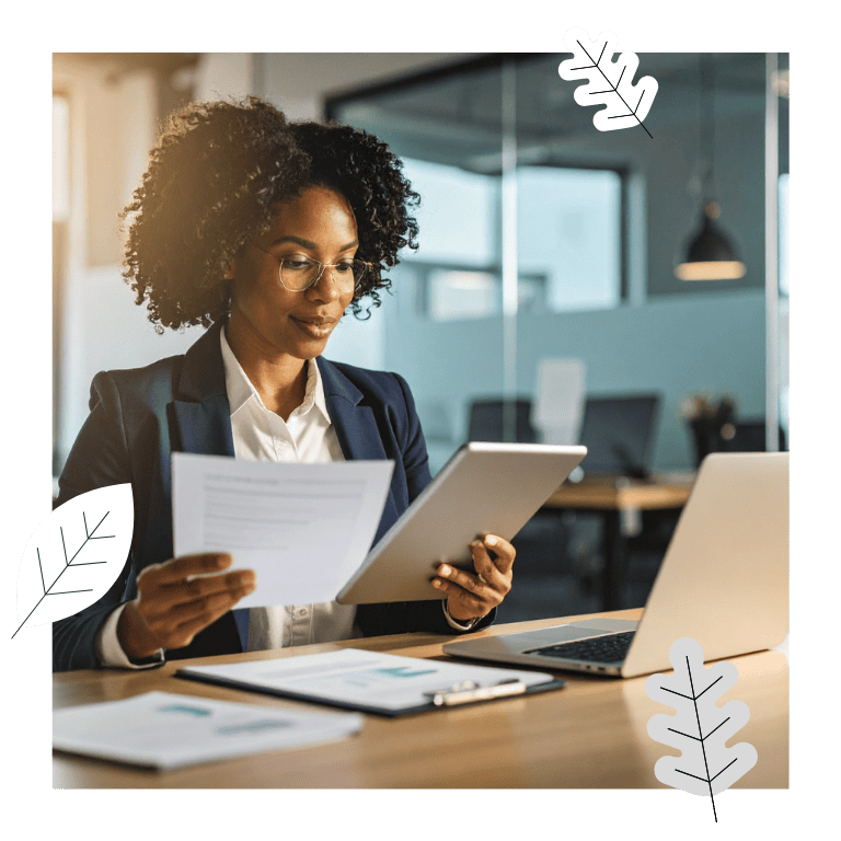 Business professional reviewing a contract document on a tablet as part of a Salesforce contract management workflow